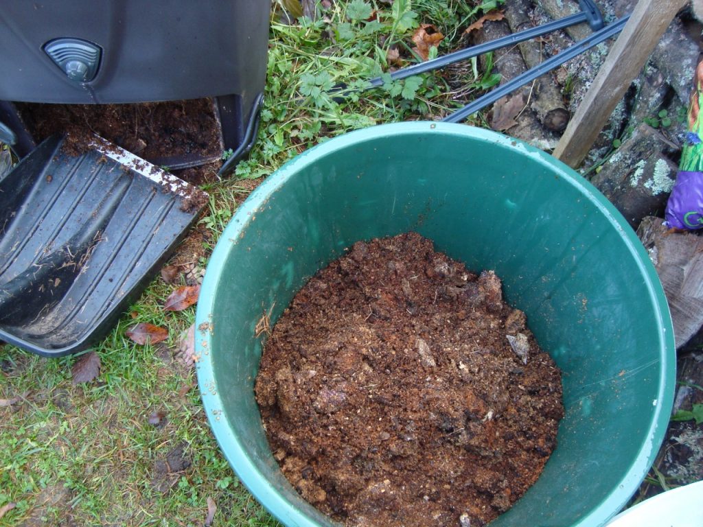 emptying a compost bin